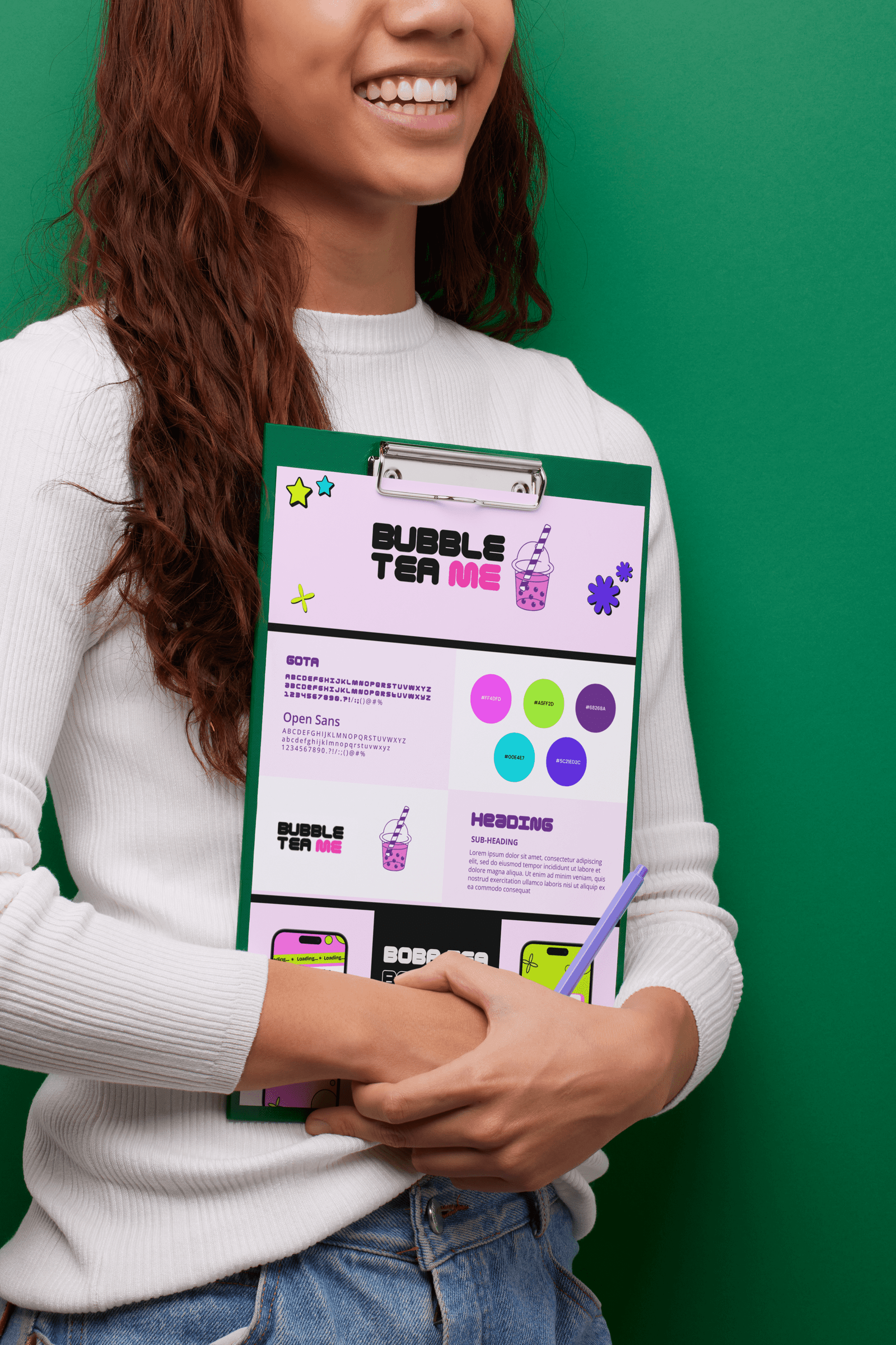 A cheerful woman holding a clipboard showcasing the colorful branding design for a bubble tea business, with vibrant colors and playful graphics.